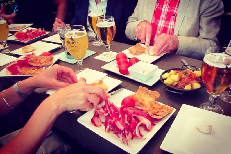Me and my new friends learning how to make the classic Spanish dish, Pan con tomate