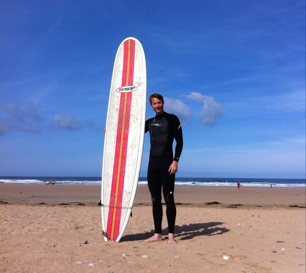 Me back in the day, before surfing at Newquay beach, Cornwall
