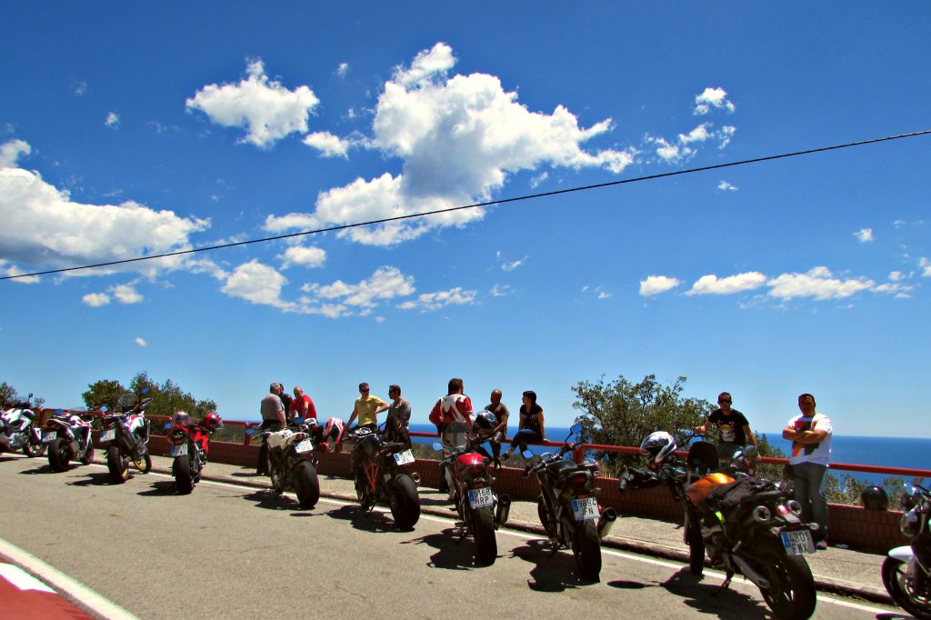 Motocycles lined up at a vista point along the Costa Brava coastal road just north of Tossa de Mar,