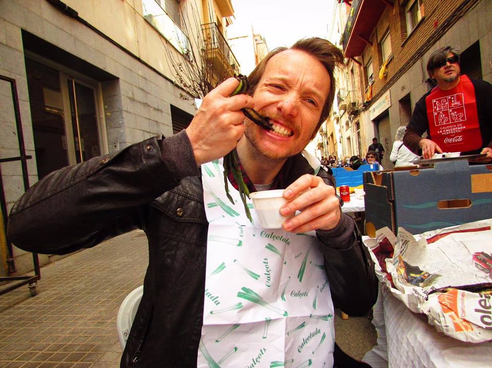 Travel & food writer Ben Holbrook eating calcots in Barcelona