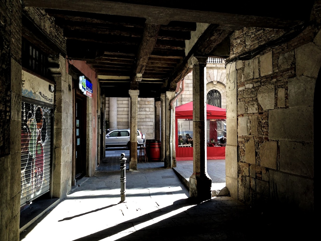 Sun and shadows in the backstreets of Raval, Barcelona
