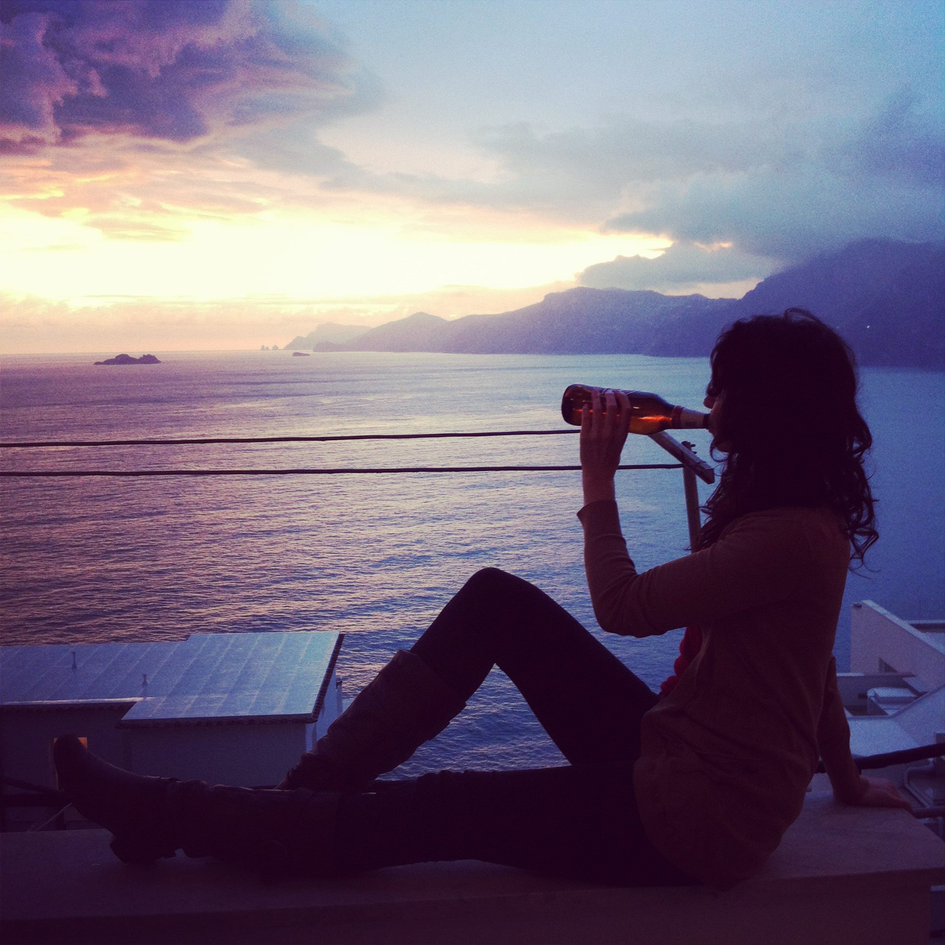my girlfriend, Sylvia, enjoying a cold beer on our balcony in Praiano, Amalfi Coast, Italy