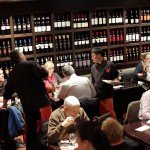 walls lined with beautiful bottles of wine and waiters serving tapas in Barcelona