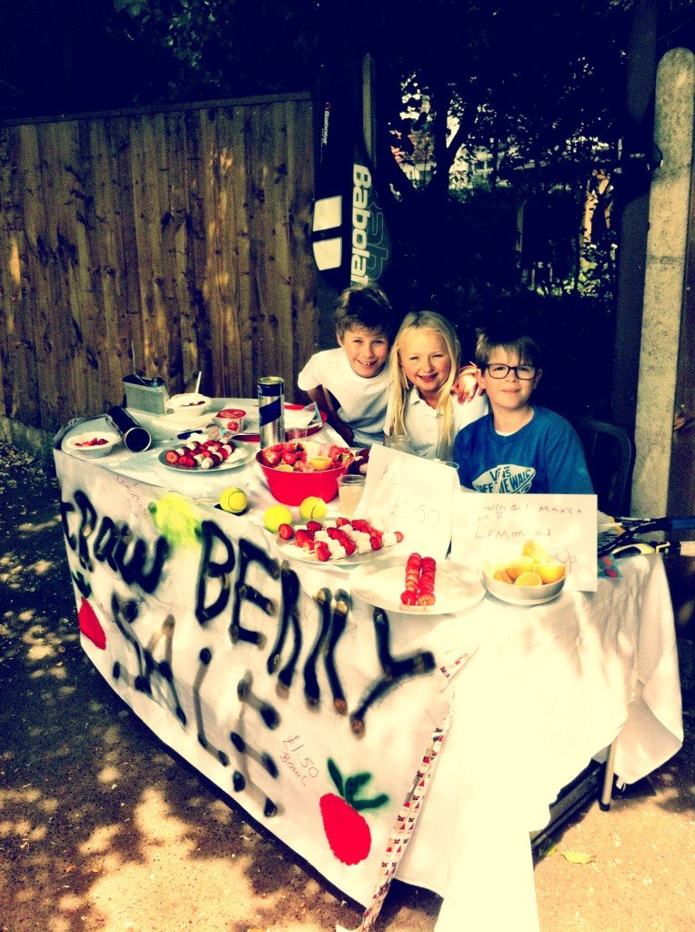 Kids selling strawberries and cream at Wimbledon tennis competition 2013