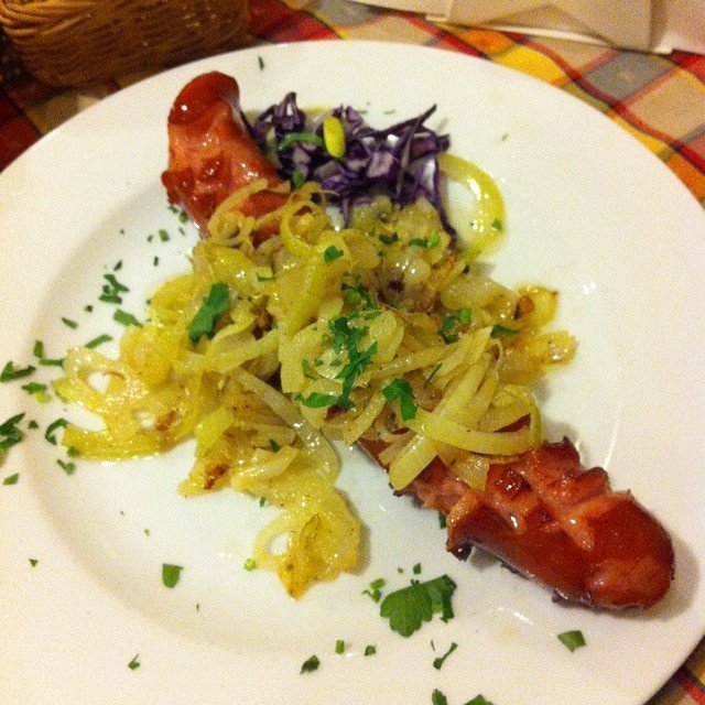 Kielbasa Sausages with fried onion in Krakow, Poland