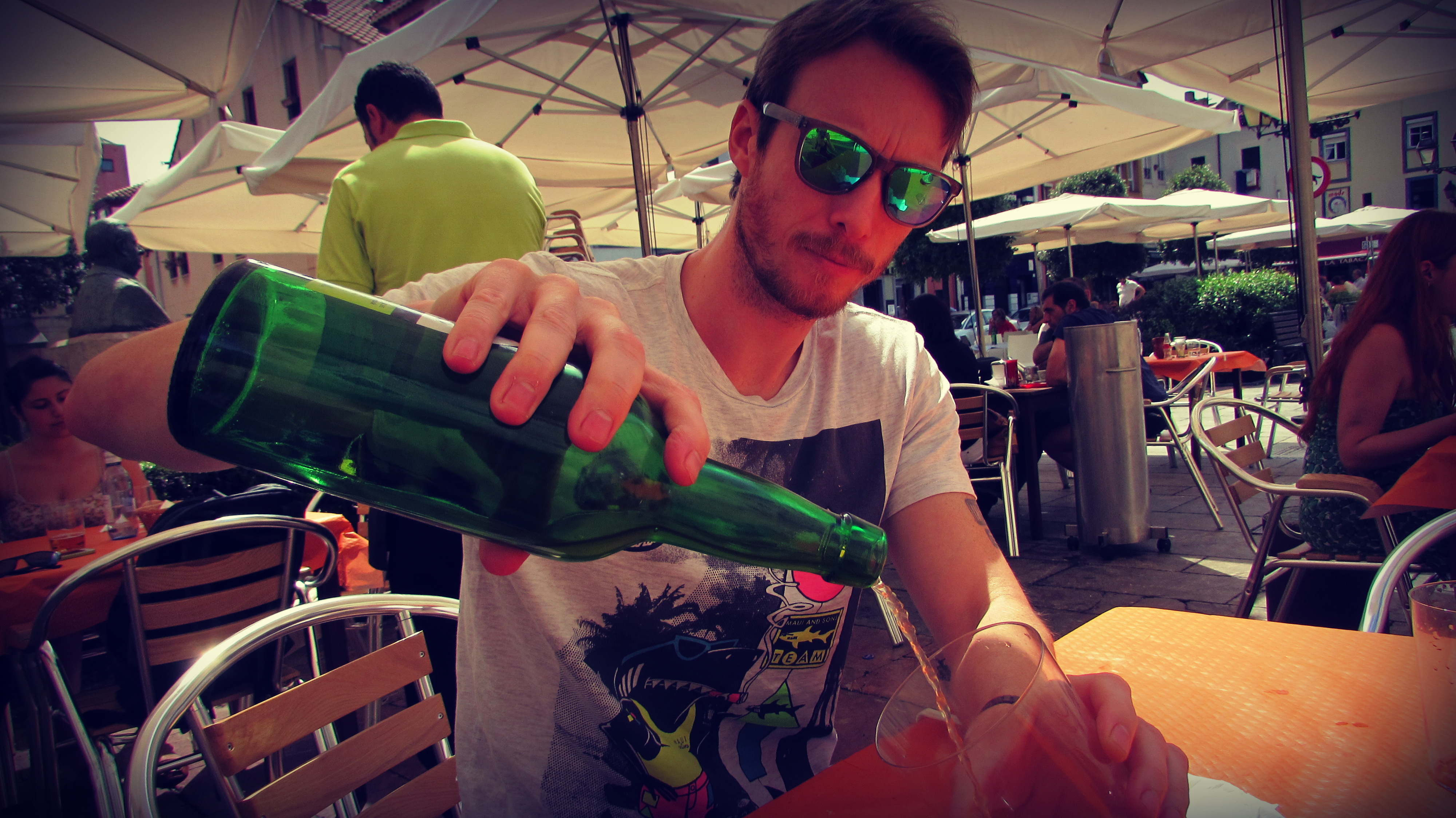 Celebrating the summer with a splash of cider, in Gijón, Asturias (northern Spain)
