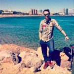 Ben Holbrook travel and food blogger at the beach in Barcelona
