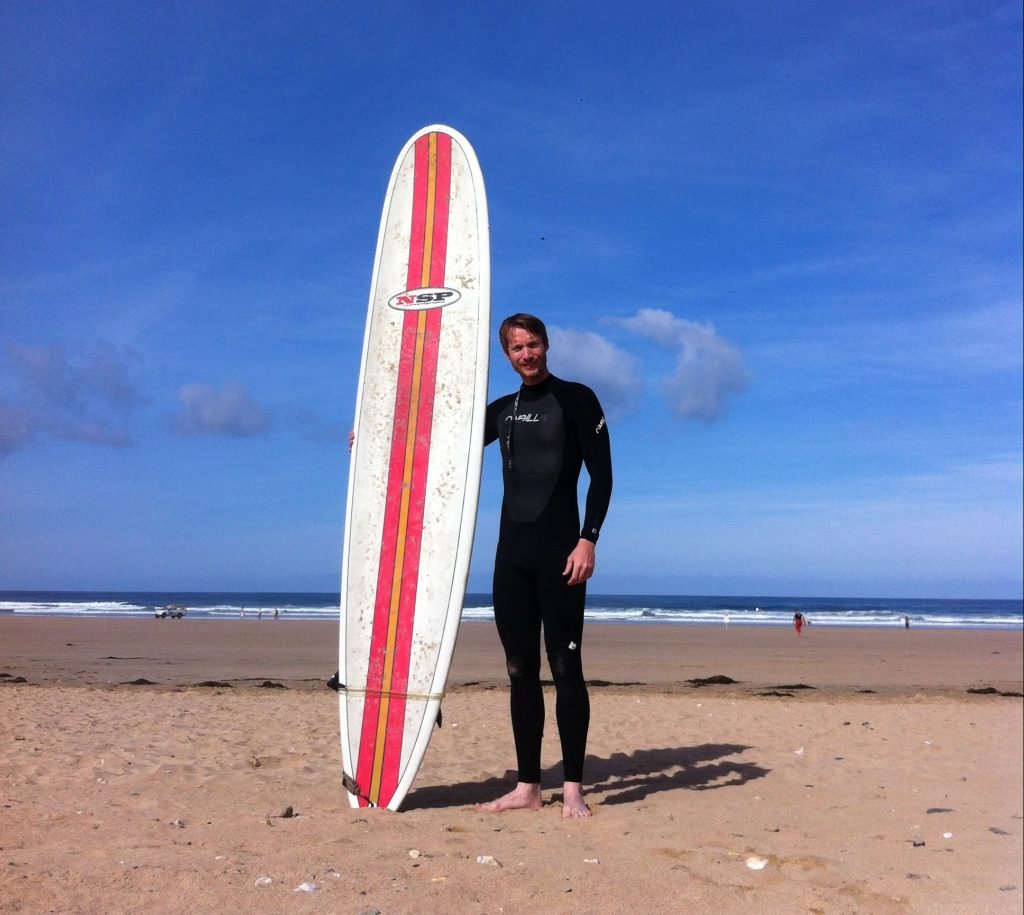 Me back in the day, before surfing at Newquay beach, Cornwall