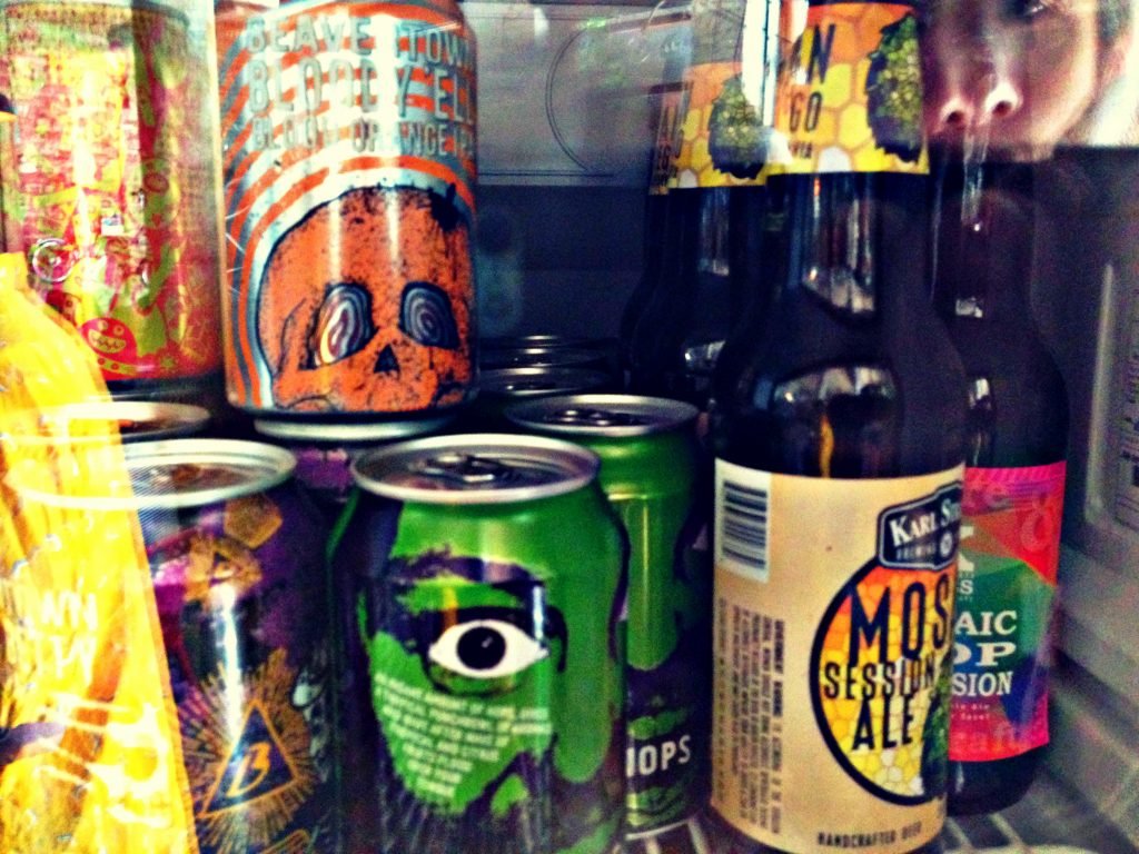 craft beer cans and bottles in the fridges at Oma Bistro in Eixample Barcelona