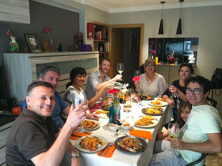 Enjoying homemade paella at a local chef's house in Barcelona