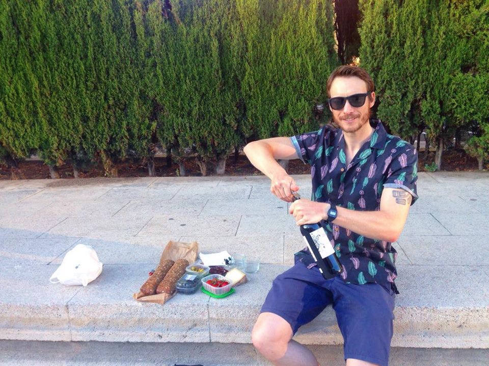 Ben preparing to picnic at sunset in Parc Joan Miró ~ Credit Ben Holbrook