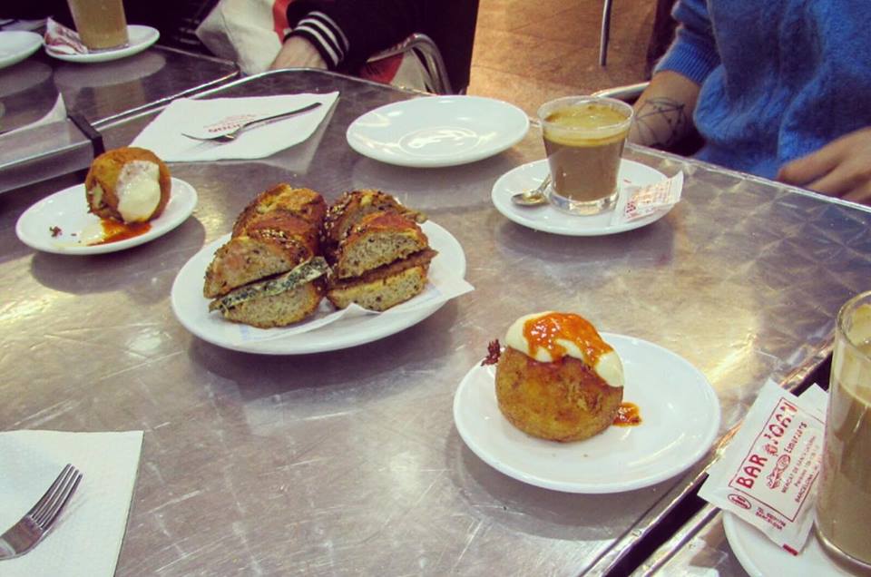 Bombas for breakfast at Bar Joan in the Santa Caterina food market in Barcelona - Barcelona Food Sherpa Market Tour and Home Dining Experience