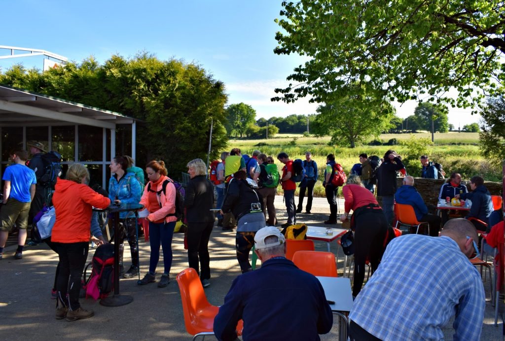 Hikers preparing on the Camino de Santiago at a Hospitalero