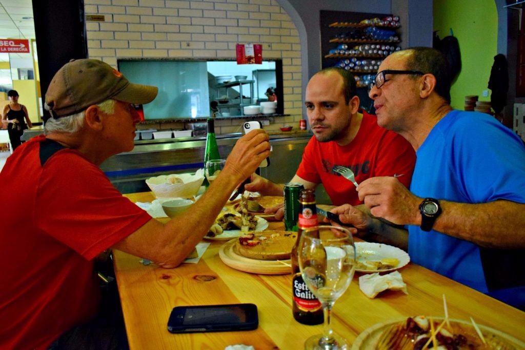 Making new friends on the Camino de Santiago - at Pulperia Ezequiel in Melide, Galicia