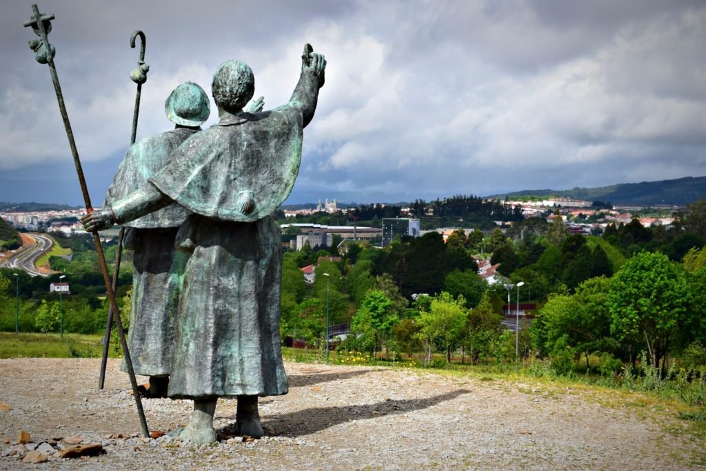 the Pilgrims Statue Looking at the cathedral de santiago de compostela