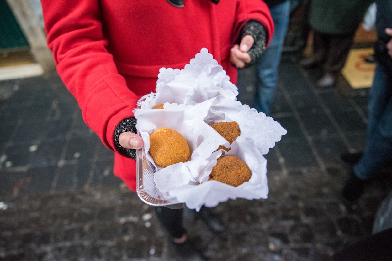 Eating suppli on Eating Italy's 'Trastevere for Foodies' food tour