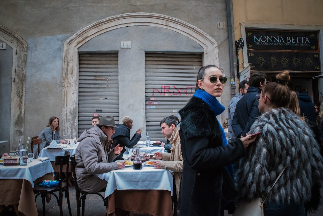 Lunchtime on Via del Portico d'Ottavia in Rome's Jewish Ghetto - by Ben Holbrook.