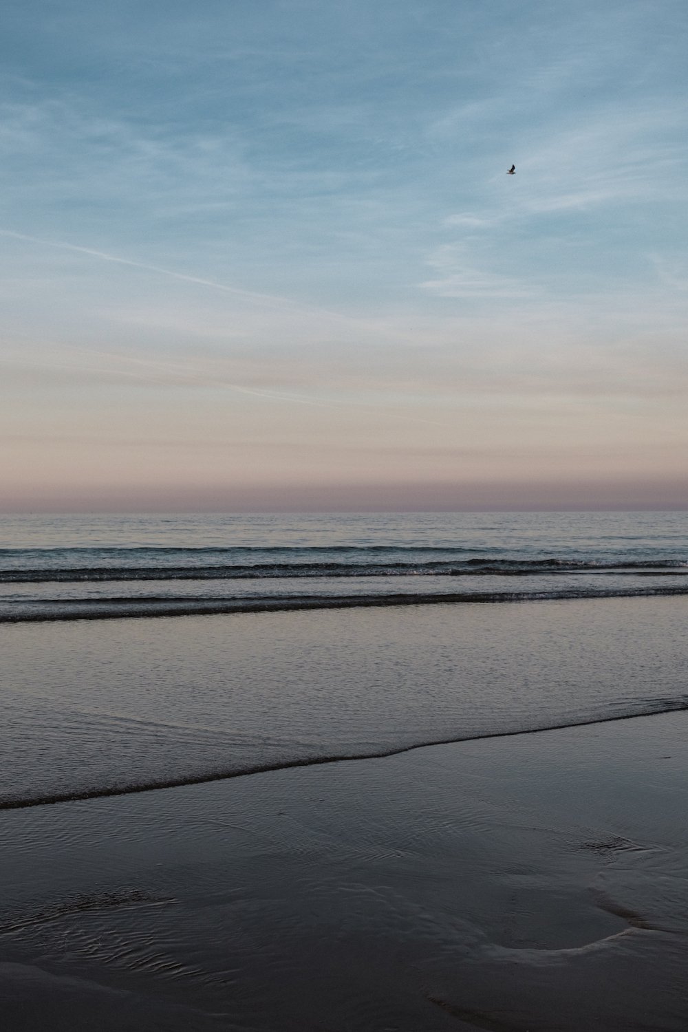 sunset on San Lorenzo beach, Gijon, Asturias, northern Spain - by Ben Holbrook from DriftwoodJournals.com 