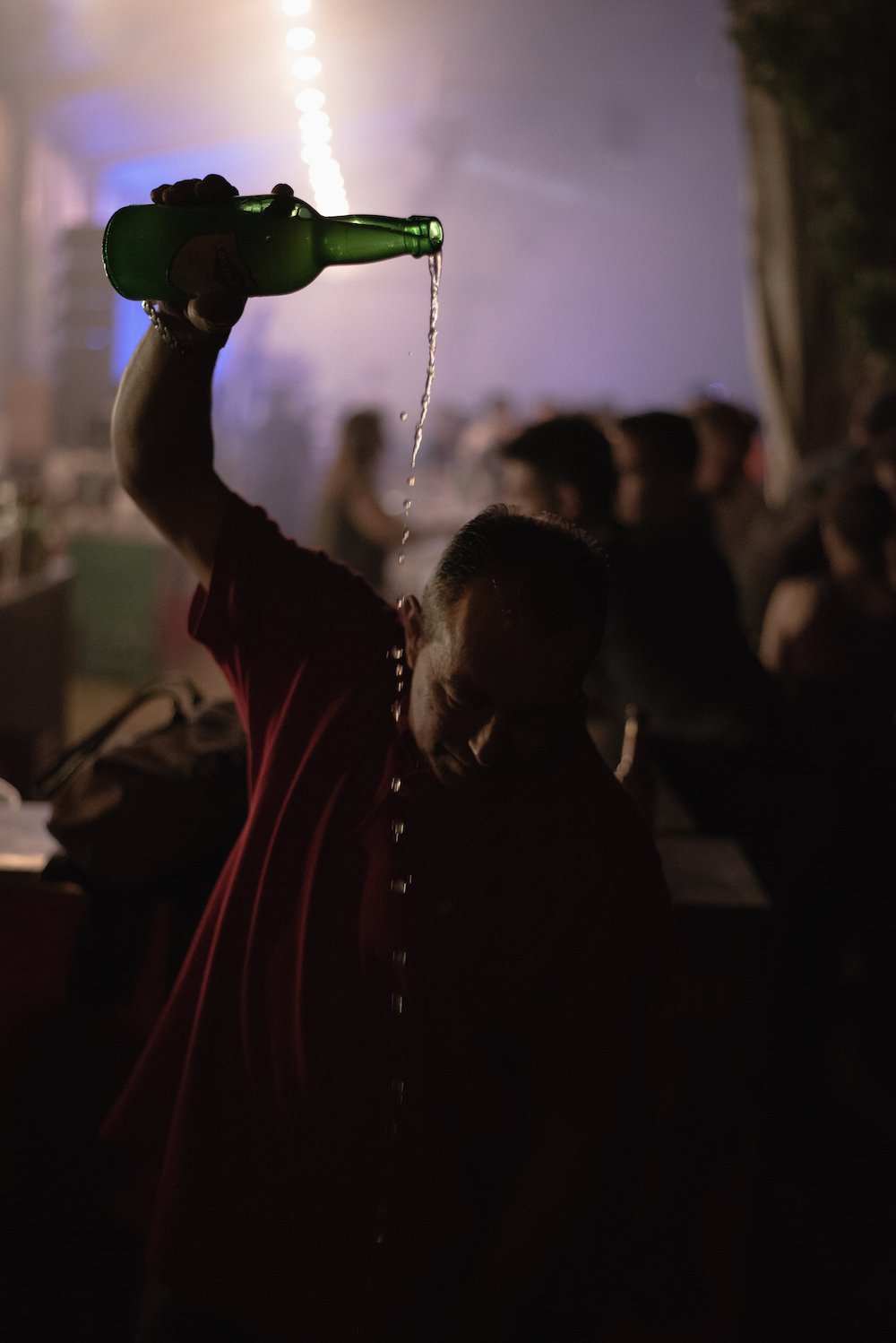 Pouring Asturian cider at a fiesta in Gijon - Asturias, northern Spain by Ben Holbrook from DriftwoodJournals.com 