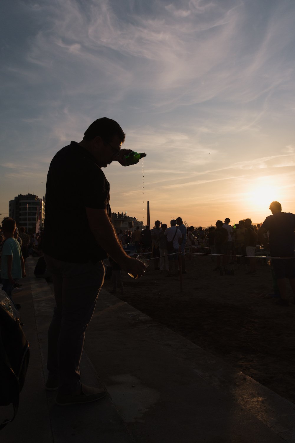 Sidra pouring world record at sunset in Gijon, Asturias, northern Spain by Ben Holbrook from DriftwoodJournals.com