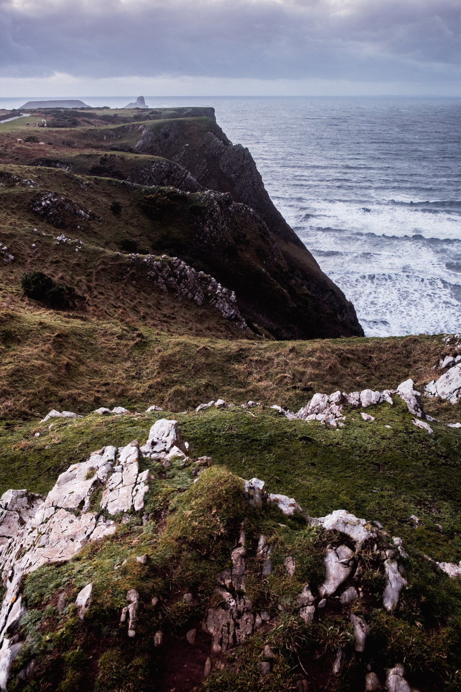 Looking over the cliffs to Worm's Head, Rhossili Bay (Gower Peninsula, South Wales). Looking over the cliffs to Worm's Head, Rhossili Bay (Gower Peninsula, South Wales).