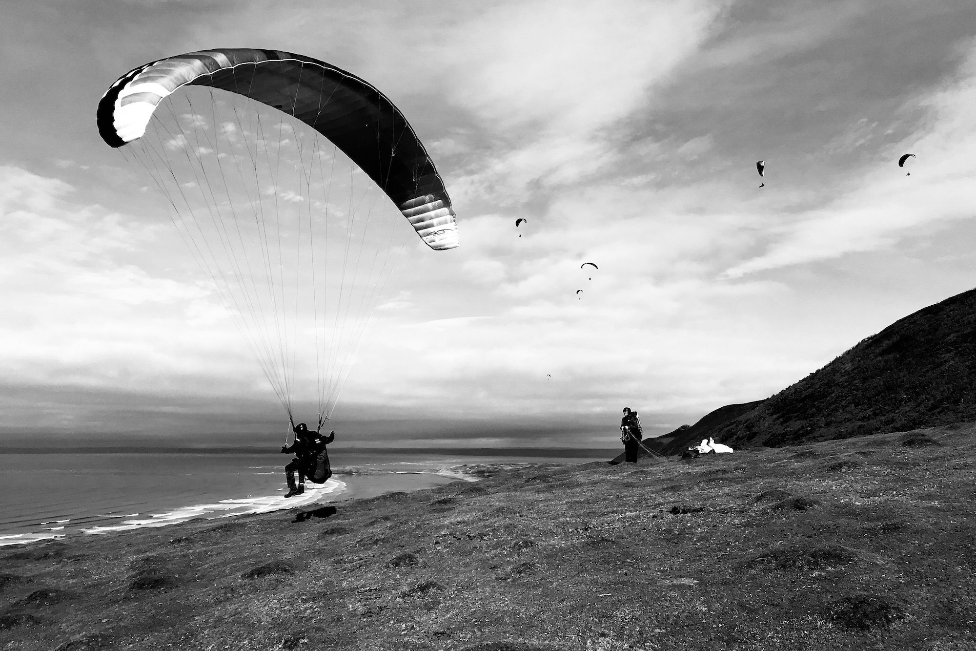 Paragliders at Rhossili Bay Beach Gower Peninsula Black and White Photographs - Copyright Ben Holbrook from DriftwoodJournals.com5