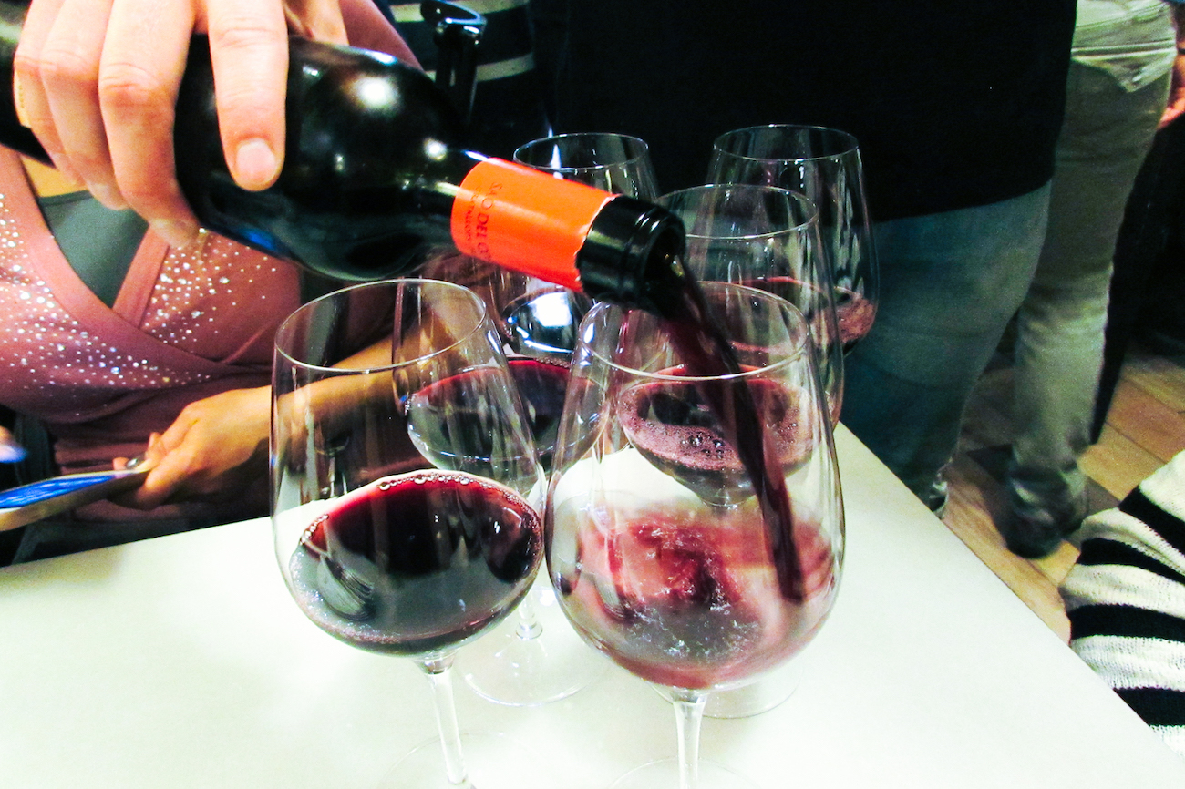 Drinking Spanish wine at Bar del Pla on the Barcelona Food Lovers Company Food Tour in Barceloneta.