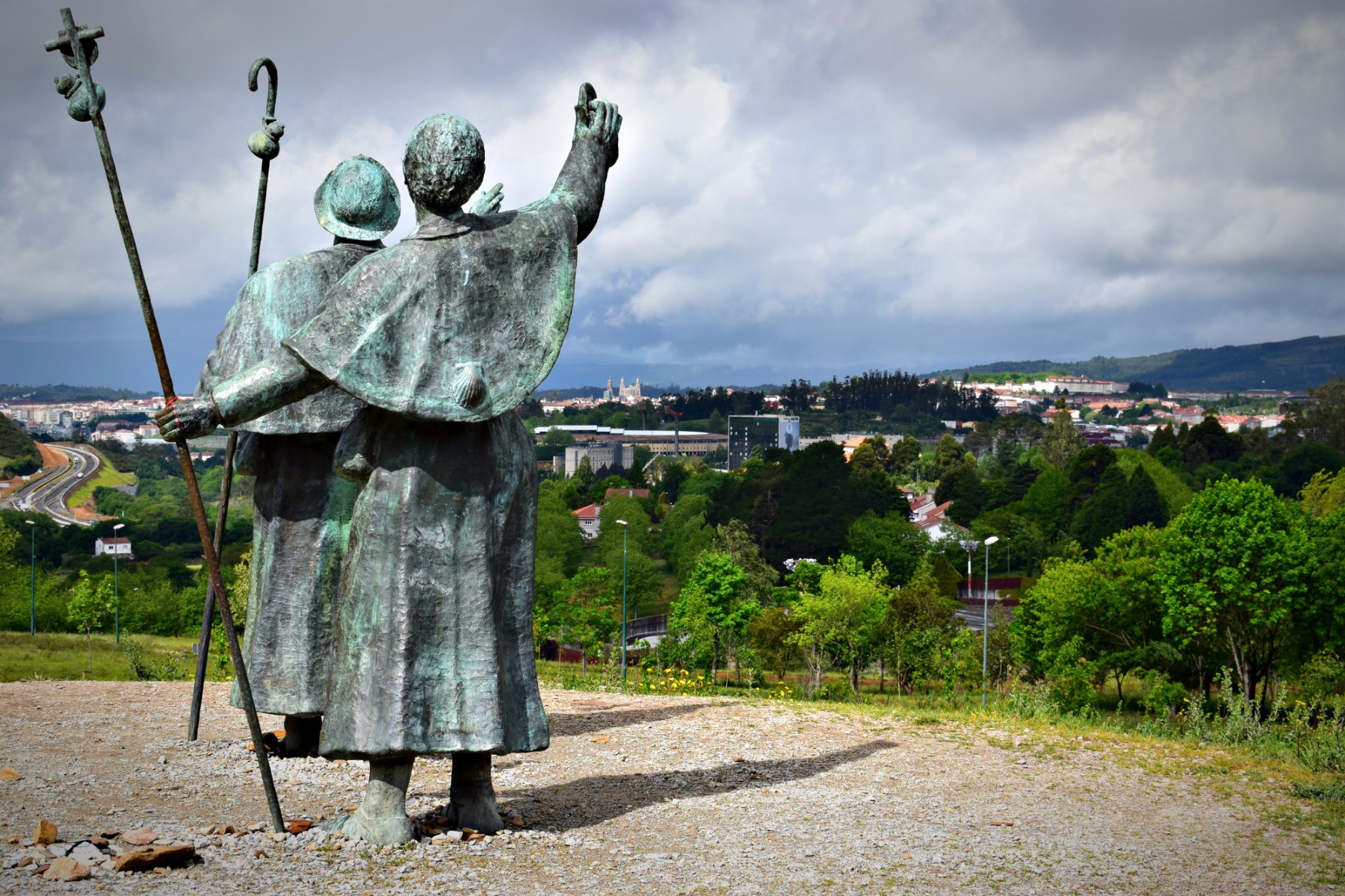 The Pilgrims Statue Looking At The Cathedral De Santiago De Compostela the-pilgrims-statue-looking-at-the-cathedral-de-santiago-de-compostela