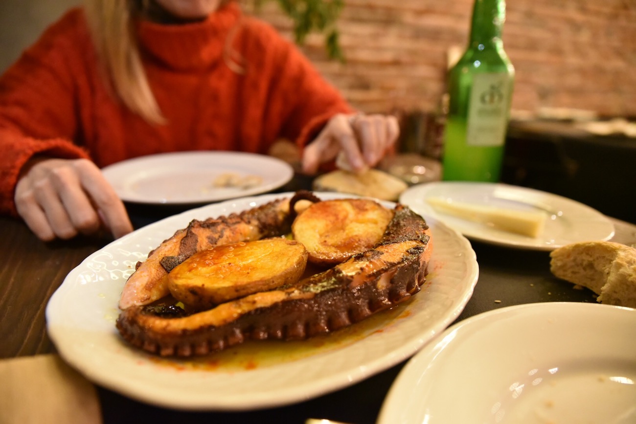 Eating pulpo (octopus) in Llanes, Asturias.