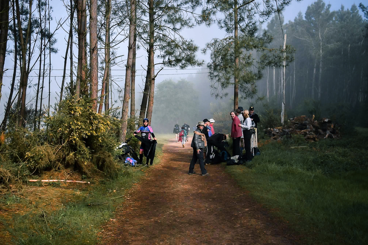 Temperatures rise dramatically once the fog burns off Camino de Santiago. Cyclists and hiker stop to remove layers. Temperatures rise dramatically once the fog burns off Camino de Santiago. Cyclists and hiker stop to remove layers.