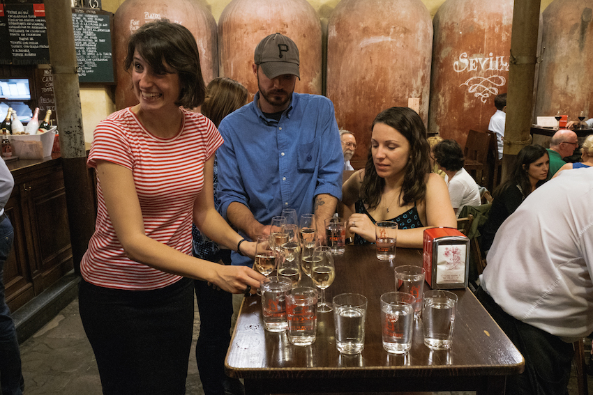 Sara from Devour Seville Food Tours delivers the goods (sherry). Sara from Devour Seville Food Tours delivers the goods (sherry).